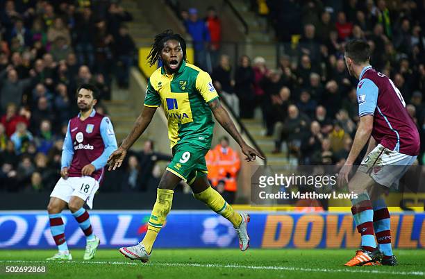 Dieumerci Mbokani of Norwich City celebrates scoring his team's second goal during the Barclays Premier League match between Norwich City and Aston...