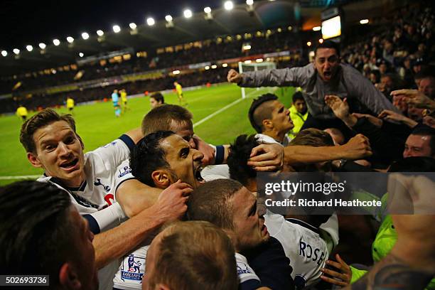 Son Heung-min of Tottenham Hotspur celebrates scoring his team's second goal with his team mates and supporters during the Barclays Premier League...