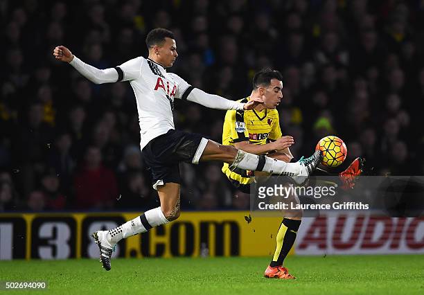 Dele Alli of Tottenham Hotspur and Jose Manuel Jurado of Watford compete for the ball during the Barclays Premier League match between Watford and...