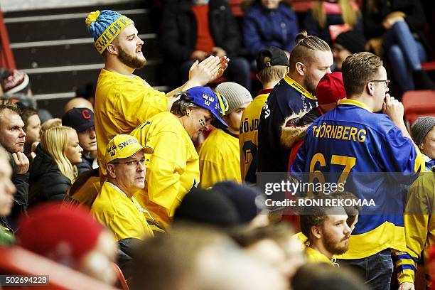 Supporters of Sweden cheer during the 2016 IIHF World Junior Ice Hockey Championship match between Sweden and USA in Helsinki, Finland, on December...