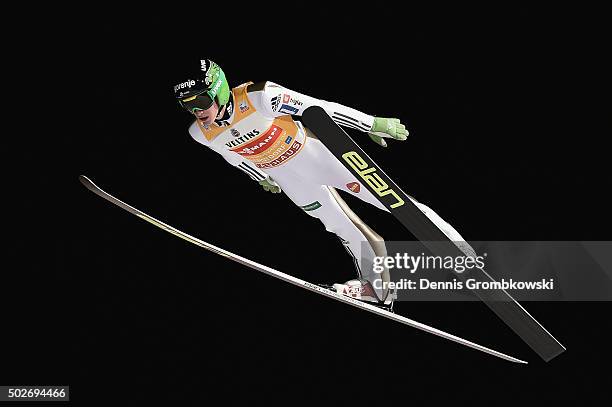 Peter Prevc of Slovenia soars through the air during his qualification jump on Day 1 of the 64th Four Hills Tournament ski jumping event on December...