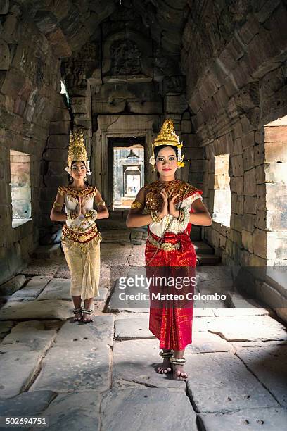 two khmer apsara dancers inside angkor wat temple - angkor wat stock pictures, royalty-free photos & images