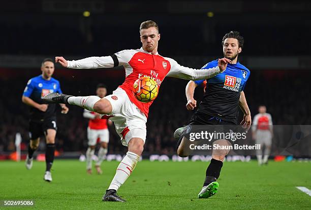 Calum Chambers of Arsenal and Harry Arter of Bournemouth compete for the ball during the Barclays Premier League match between Arsenal and A.F.C....