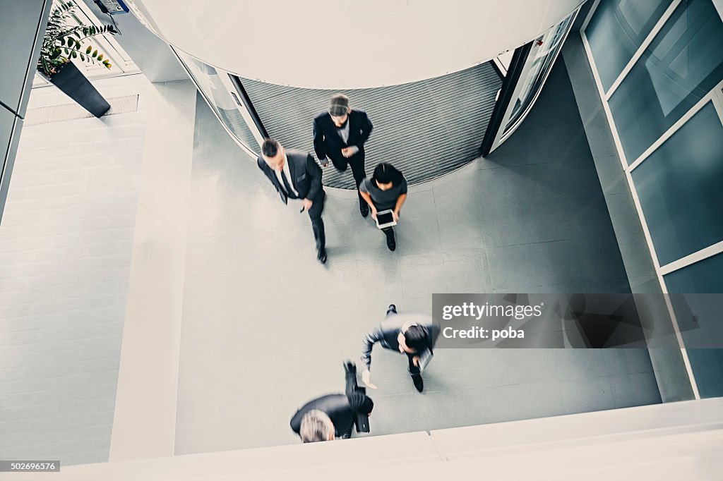 Group of  businesspeople entering the lobby