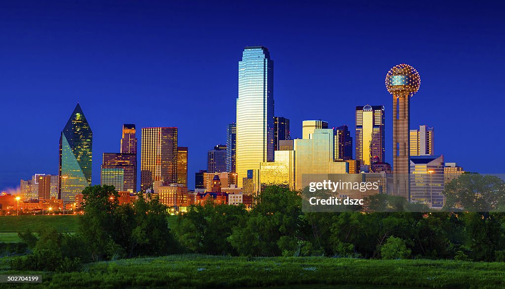 Downtown Dallas Cityscape Skyline Skyscrapers glowing at dusk / twilight