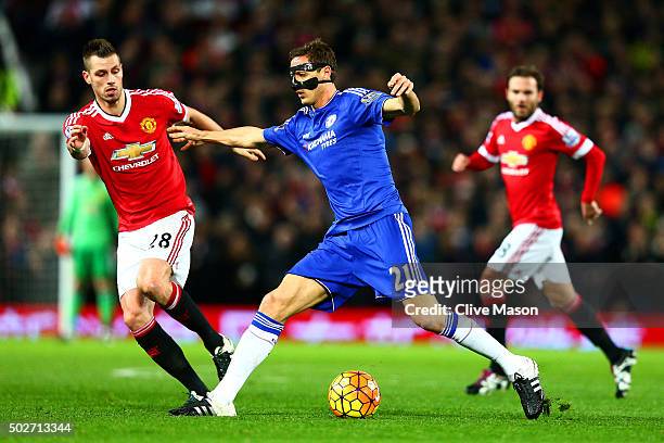 Nemanja Matic of Chelsea battles for the ball with Morgan Schneiderlin of Manchester United during the Barclays Premier League match between...