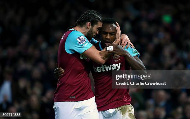 Michail Antonio of West Ham United celebrates with Andy Carroll of West Ham United after deflecting the ball into the net for his side's first goal...