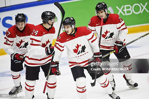 Canada's Mitchell Stephens, Travis Dermott, Travis Konecny and Roland McKeown celebrate the 4-1 goal during the 2016 IIHF World Junior Ice Hockey...