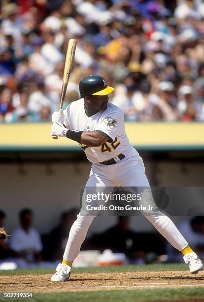 Dave Henderson of the Oakland Athletics readies to swing at the pitch during an MLB game against the Milwaukee Brewers on April 11, 1993 at the...