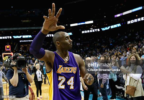 Kobe Bryant of the Los Angeles Lakers reacts after being defeated by the Charlotte Hornets 108-98 at Time Warner Cable Arena on December 28, 2015 in...