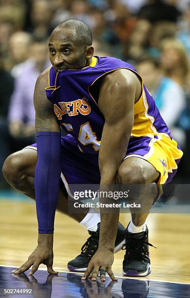 Kobe Bryant of the Los Angeles Lakers reacts during their game against the Charlotte Hornets at Time Warner Cable Arena on December 28, 2015 in...