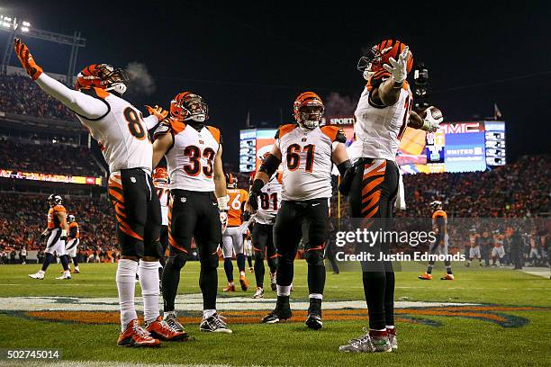 Wide receiver Mohamed Sanu of the Cincinnati Bengals celebrates with Marvin Jones, Rex Burkhead, and Russell Bodine after scoring a touchdown on a...