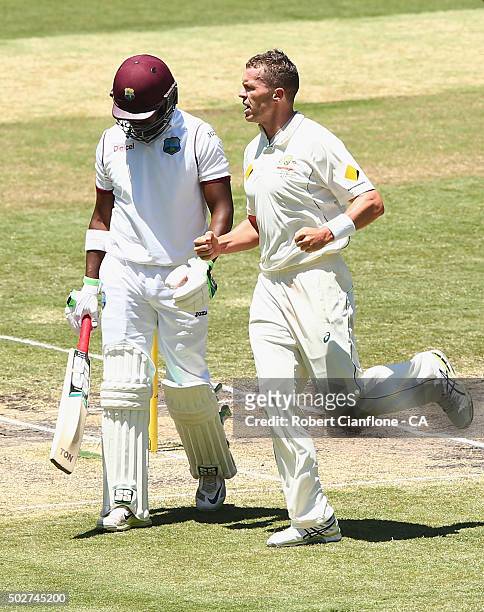 Peter Siddle of Australia celebrates after taking the wicket of Darren Bravo of the West Indies during day four of the Second Test match between...