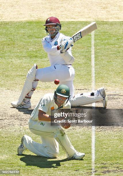 Denesh Ramdin of the West Indies hits a boundary past Joe Burns of Australia during day four of the Second Test match between Australia and the West...