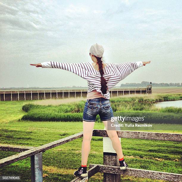 freedom- young woman in field - pretending to be a plane stock pictures, royalty-free photos & images