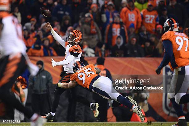 McCarron of the Cincinnati Bengals gets rid of the ball while under pressure from Derek Wolfe of the Denver Broncos in the fourth quarter. The Denver...