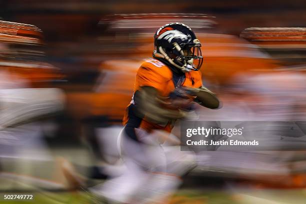 Running back Ronnie Hillman of the Denver Broncos rushes against the Cincinnati Bengals during a game at Sports Authority Field at Mile High on...