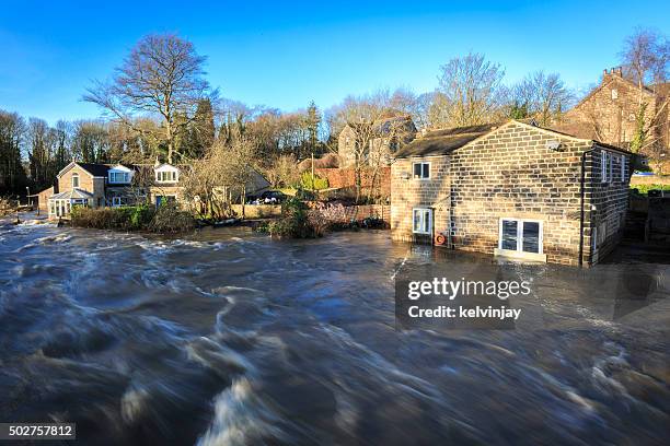 houses by the river aire in leeds during a flood - west yorkshire stock pictures, royalty-free photos & images