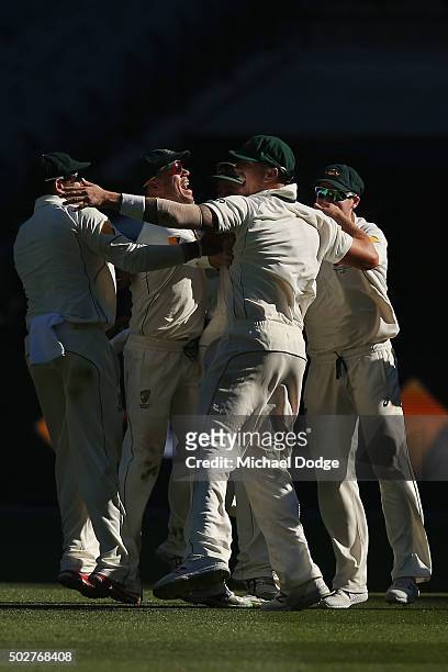 James Pattinson of Australia celebrates taking the match winning catch with David Warner and teammates during day four of the Second Test match...