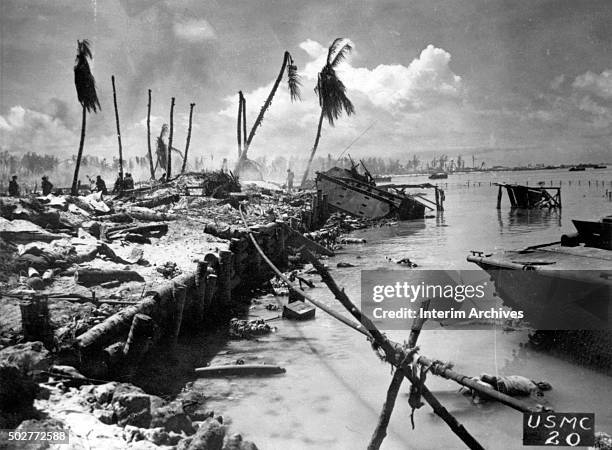 View of corpses and abandoned equipment on and in a lagoon in the aftermath of combat in the wake of US Marine landings, Tarawa, Kiribati, 1943.