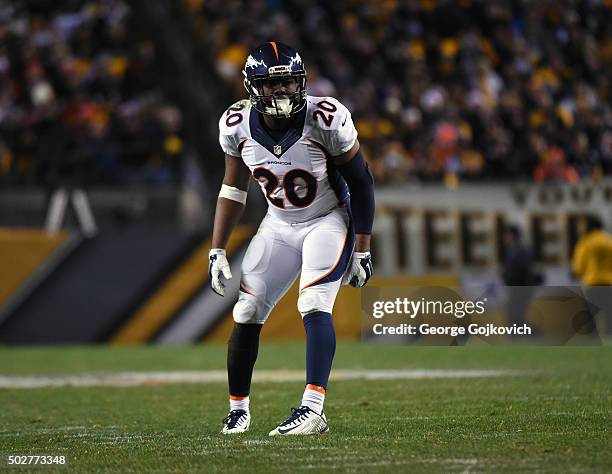 Safety Josh Bush of the Denver Broncos looks on from the field during a game against the Pittsburgh Steelers at Heinz Field on December 20, 2015 in...
