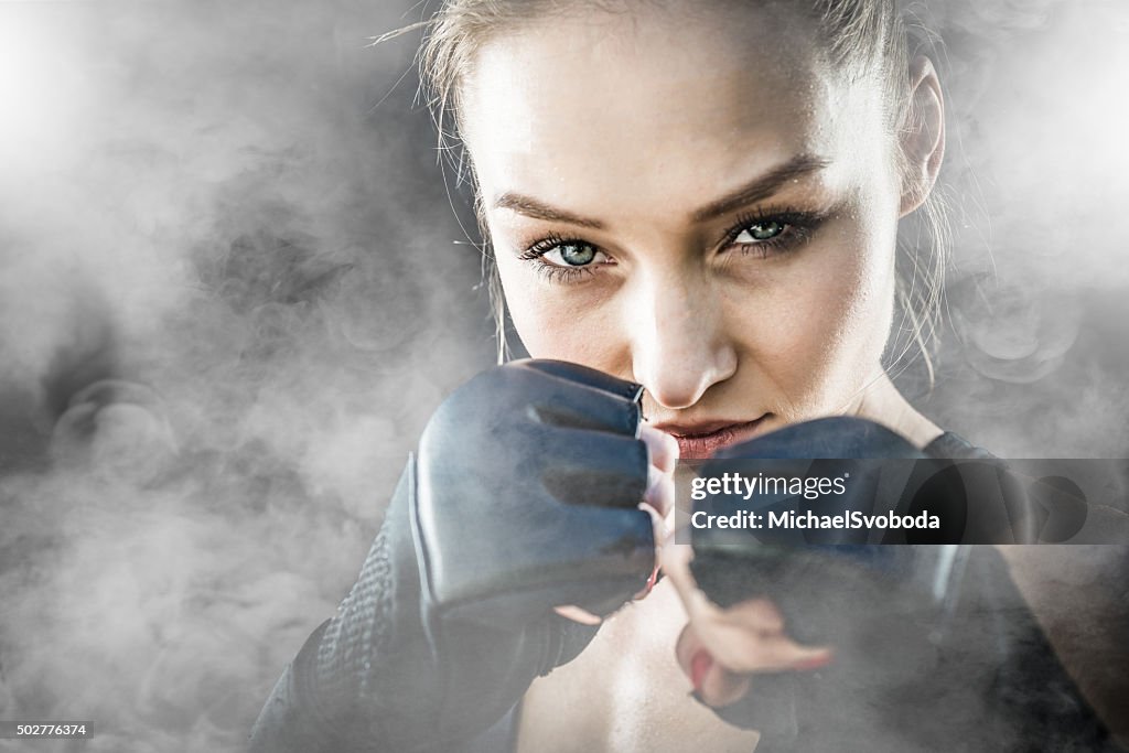 MMA Fighter On A Smokey  Background