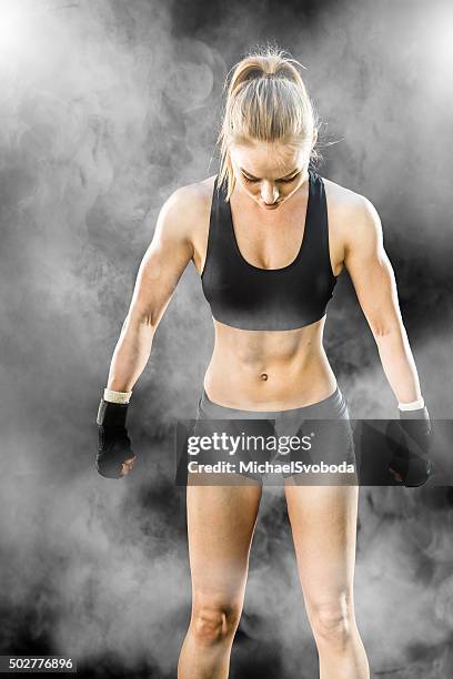 mma fighter on a smokey  background - martial arts background stock pictures, royalty-free photos & images