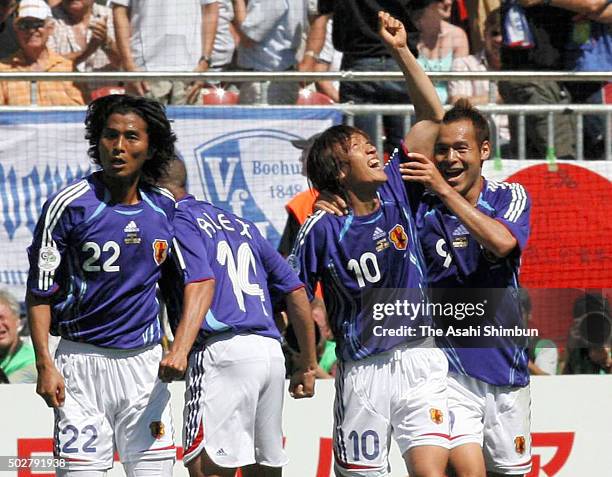 Shunsuke Nakamura of Japan celebrates scoring his team's first goal with his team mates during the FIFA World Cup Germany 2006 Group F match between...