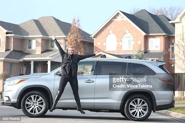 In Toronto on December 5, 2015 Christina Ritchie poses with her Toyota Highlander.