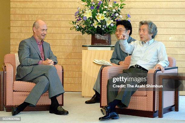 World Trade Organization Director-General Pascal Lamy talks with Japanese Prime Minister Junichiro Koizumi at Koizumi's official residence on July 6,...