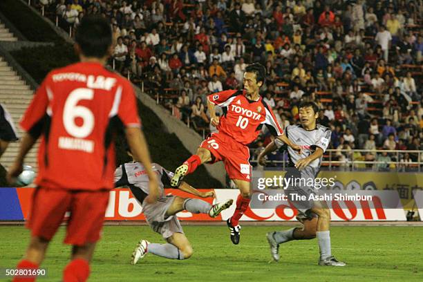 Toshiya Fujita of Nagoya Grampus Eight scores his team's first goal during the J.League match between Nagoya Grampus Eight and Yokohama F.Marinos at...