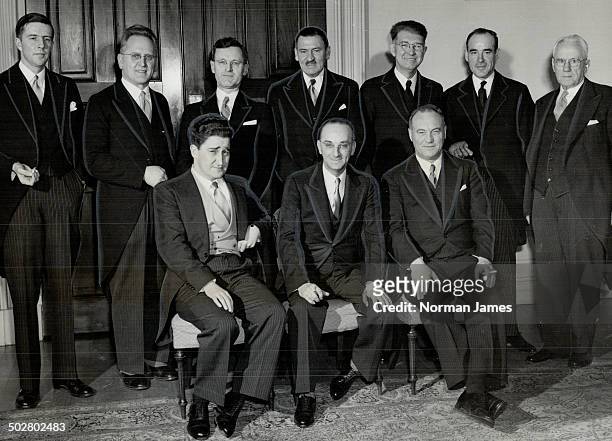 Members of Newfoundland's provisional cabinet shown here include; front row; left to right: W. J. Keough; Premier J. R. Smallwood; H. W. Quinton....