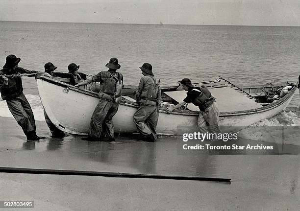 On the low sandy shore of Sable island; a treach sand result of many shipwrecks over several hundred year itself yard of the Atlantic; the members of...