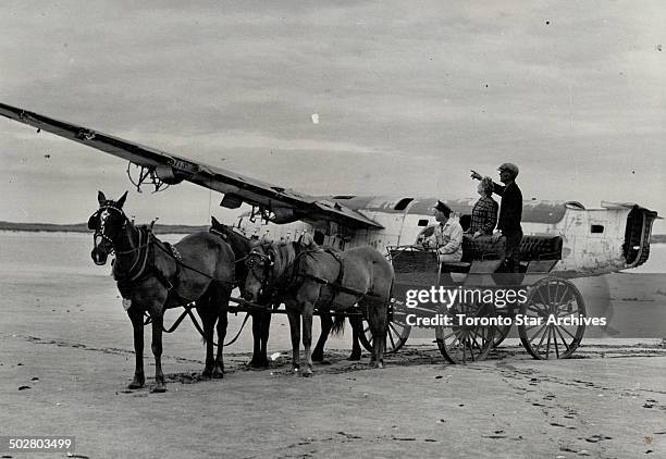 Vehicle transferring supplies from a plane swam ashore froma wrecked like all the wagons used on Sable island breed has improved. Four horses are...