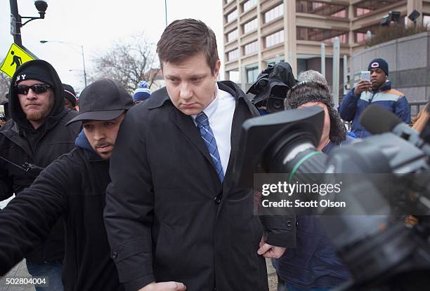 Chicago police officer Jason Van Dyke leaves the Criminal Courts Building after pleading not guilty to first-degree murder charges related to the...