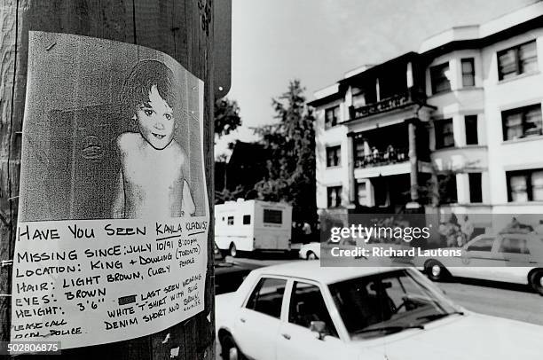 Missing child: The sign provides a description of Kayla Klaudusz; who disappeared Wednesday from the yard of the four-storey building in the back...