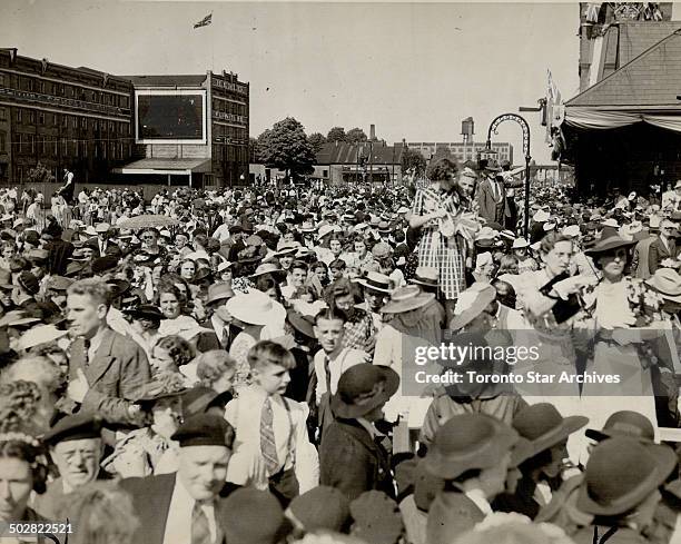 Here's a crowd of Kitchener citizens and visitors waiting for the King and Queen to pass their way. They are closely packed; but everyone seems good...