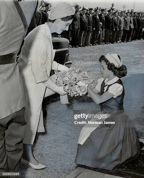 At Annapolis; N.S.; the Princess received flowers from a little girl. She left the train in the station there to mingle with the crowds on the...