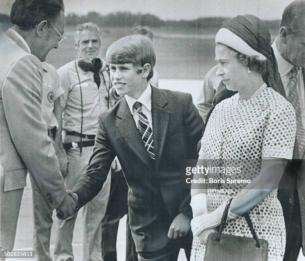 Youngest son of the Queen; 14-year-old Prince Edward; shakes hands with Saskatoon Mayor Clifford Wright yesterday on the royal family's arrival in...