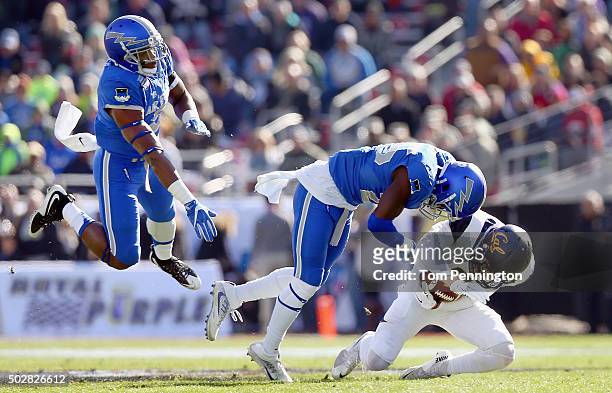 Chad Hansen of the California Golden Bear carries the ball against Roland Ladipo of the Air Force Falcons and Dexter Walker of the Air Force Falcons...