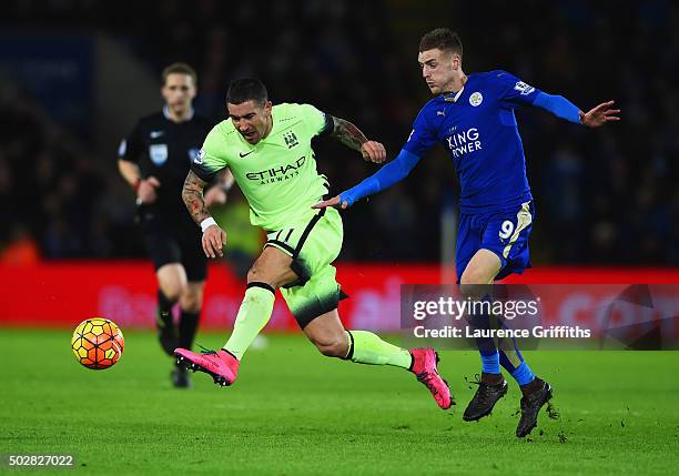 Aleksandar Kolarov of Manchester City beats Jamie Vardy of Leicester City to the ball during the Barclays Premier League match between Leicester City...