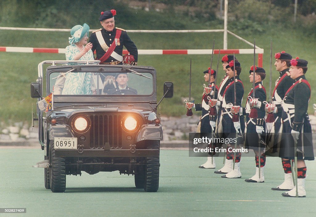 Inspects her troops: The Queen Mother; colonel-in-chief of the Black Watch of Canada; inspects her i