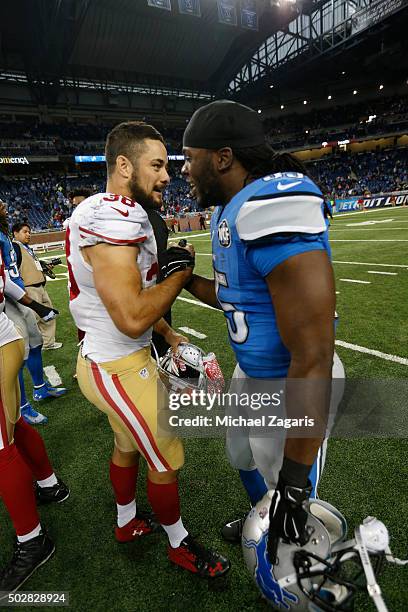 Jarryd Hayne of the San Francisco 49ers and Joique Bell of the Detroit Lions talk on the field following the game at Ford Field on December 27, 2015...
