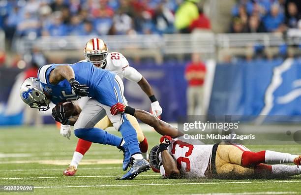 NaVorro Bowman of the San Francisco 49ers grabs a hold of Joique Bell of the Detroit Lions during the game at Ford Field on December 27, 2015 in...