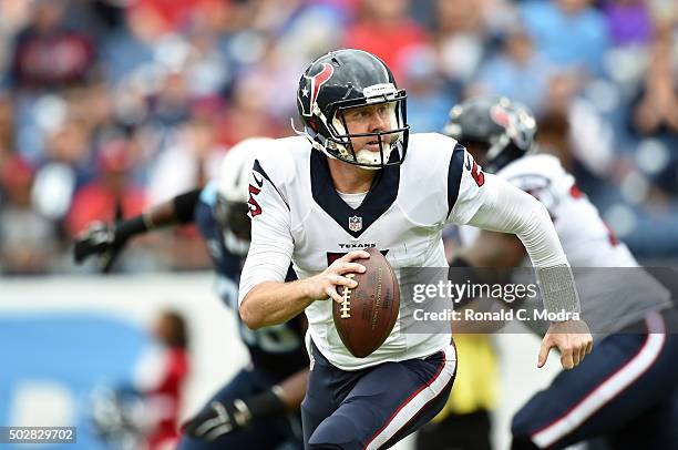 Quarterback Brandon Weeden of the Houston Texans looks for a receiver against the Tennessee Titans during a NFL game at Nissan Stadium on December...