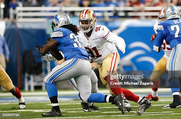 Arik Armstead of the San Francisco 49ers tackles Joique Bell of the Detroit Lions during the game at Ford Field on December 27, 2015 in Detroit,...