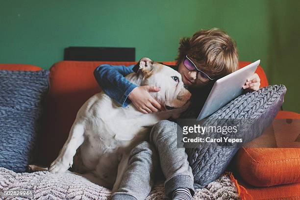 boy with tablet and dog