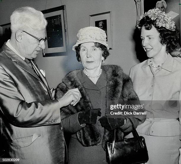 Runner-up in contest; Mrs. E. J. Norman; Roxborough St. W.; has mink stole placed over shoulders by Mayor Phillips who made presentations.