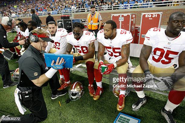 Linebackers Coach Jason Tarver of the San Francisco 49ers talks with Aaron Lynch, Eli Harold and Ahmad Brooks on the sideline during the game against...
