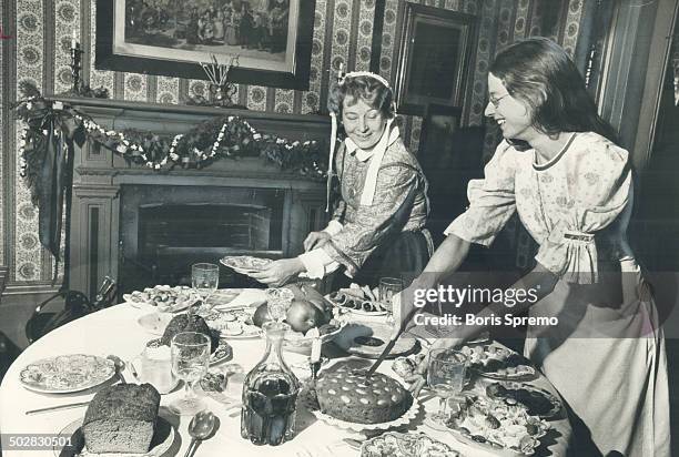 At the groaning board in Mackenzie House this week; Jenny Bull; right; and Pat Lochhead lay out a Christmas repast. In Victorian Toronto on Christmas...